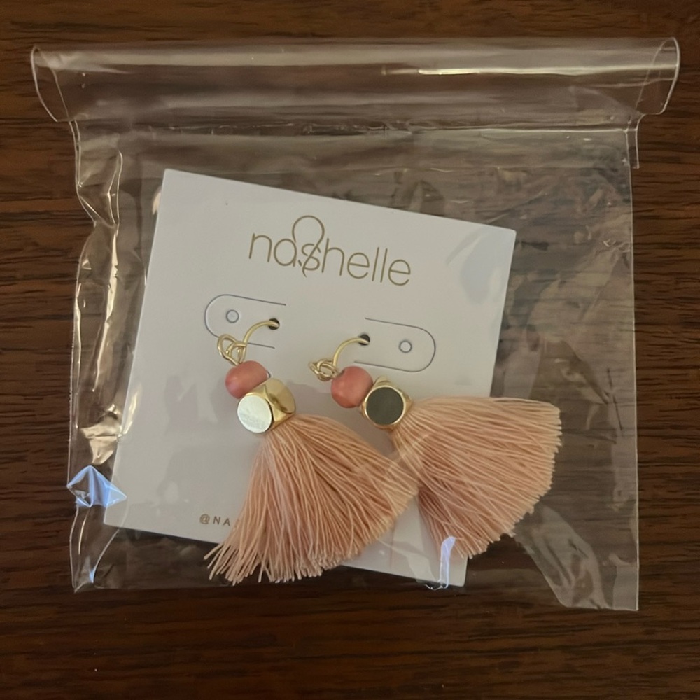 Nashelle tassel earrings in a pink/salmon color with gold fill accent.